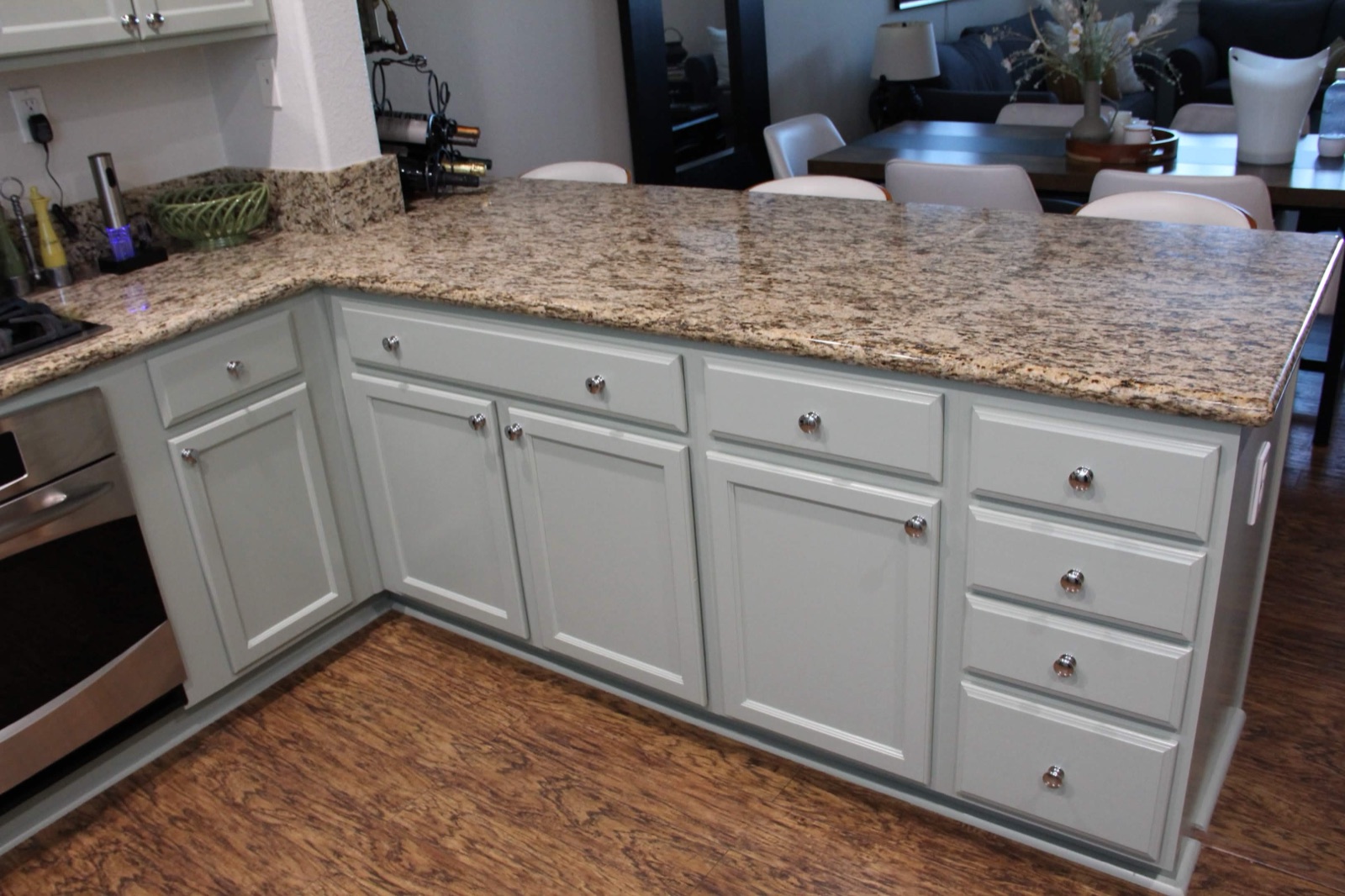 Refinished kitchen cabinets with granite countertop