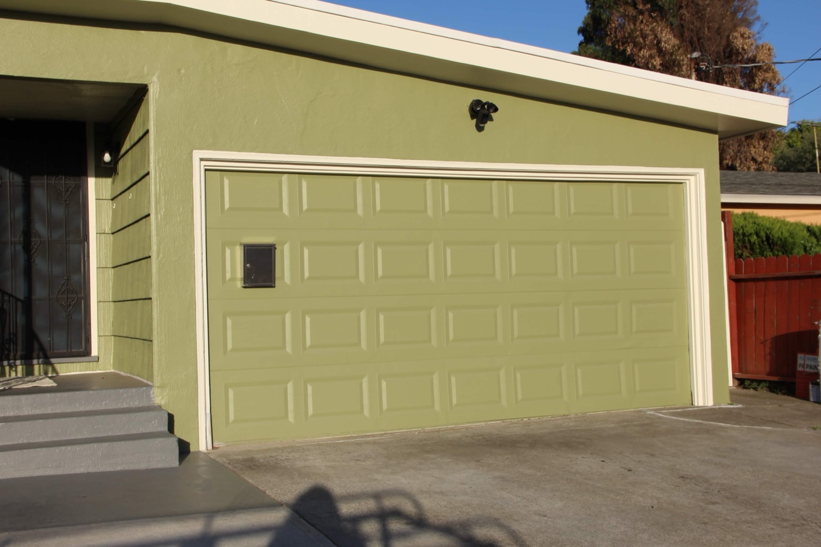 Freshly painted green garage door